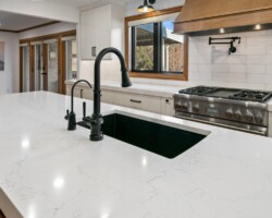 Misterio countertop with dark sink and faucet